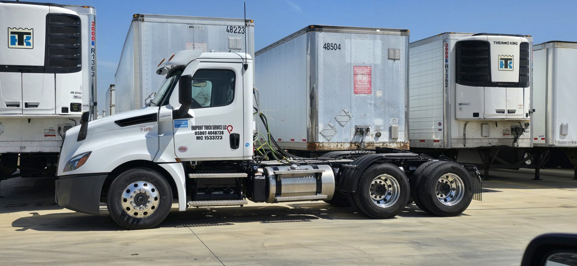 EndPoint’s white semi-truck and container chassis in the company yard